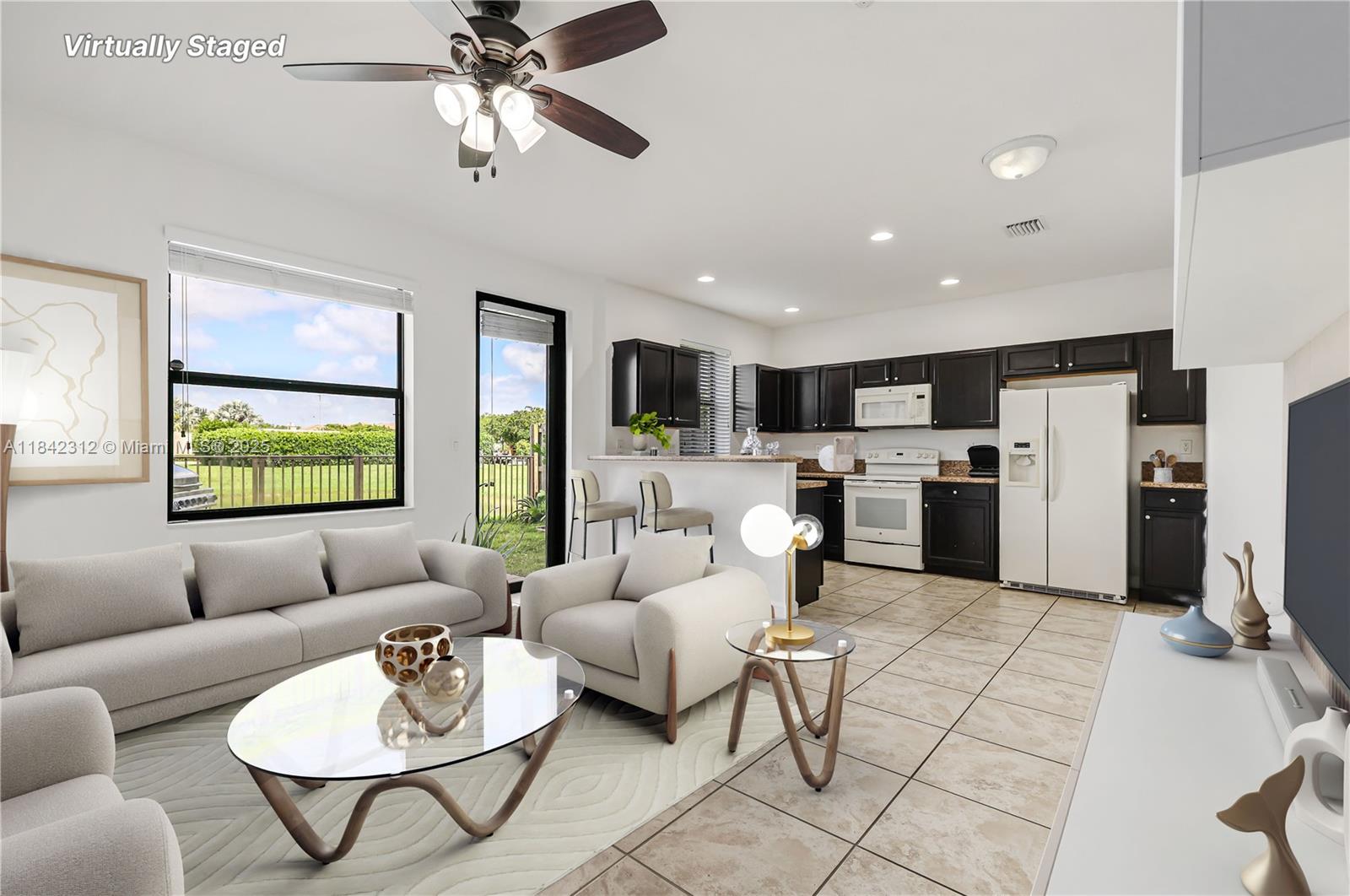 23634 Southwest 117 Place Homestead, FL 33032 - Photo 7 of 31 a living room with furniture kitchen view and a large window