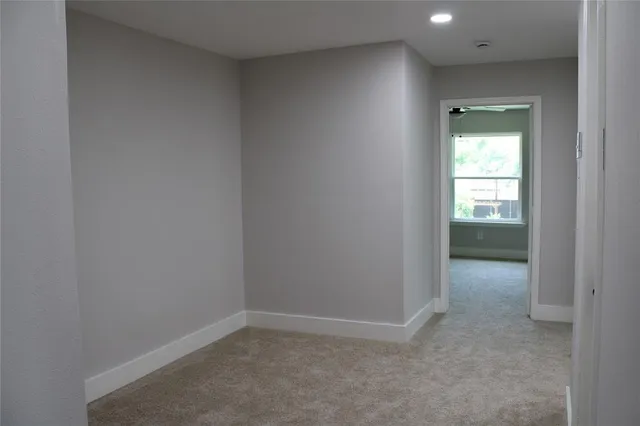 a view of an empty room and window
