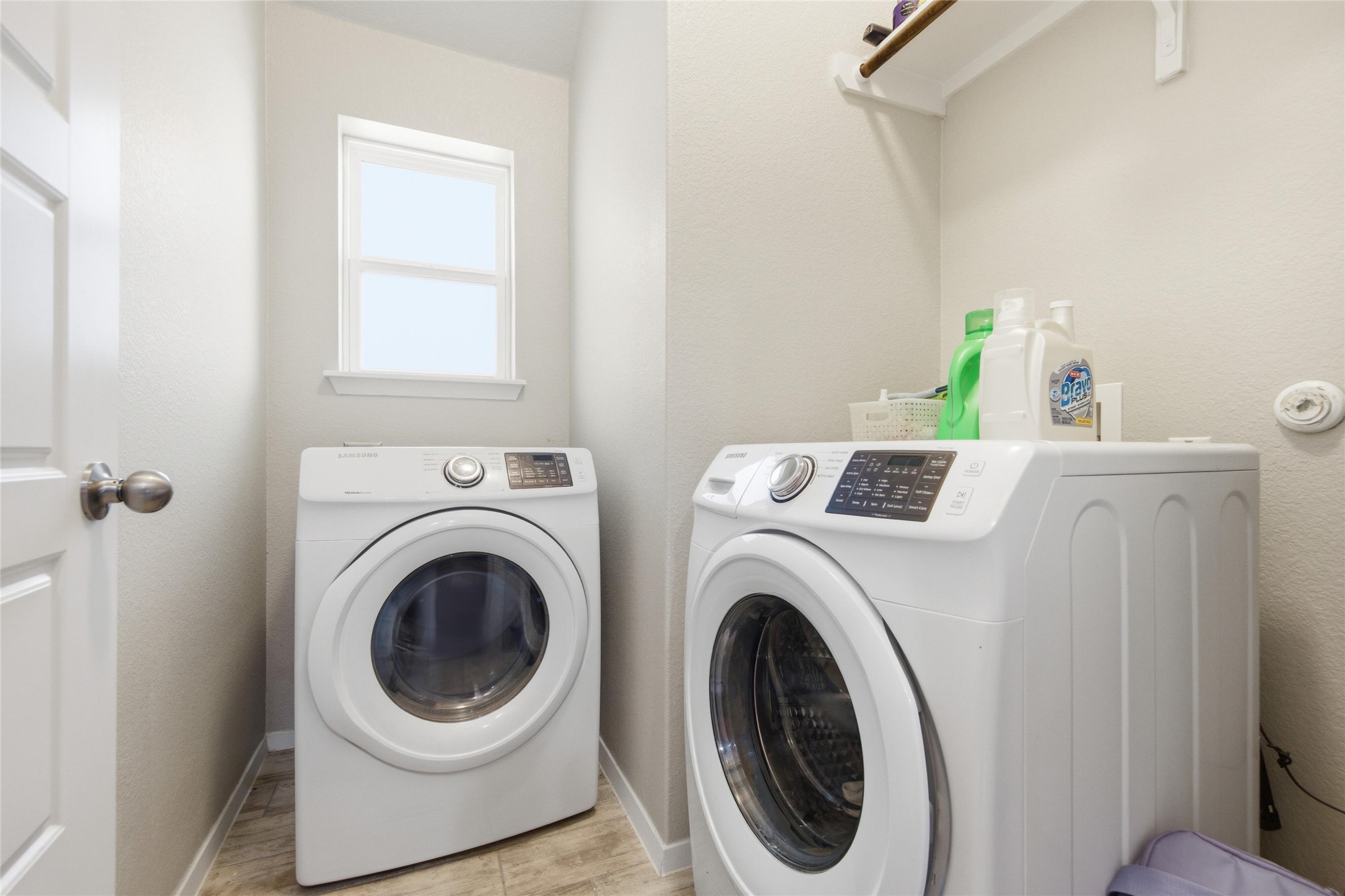 269 Gaida Loop Georgetown, TX 78628 - Photo 17 of 20 Laundry room featuring separate washer and dryer and a textured wall