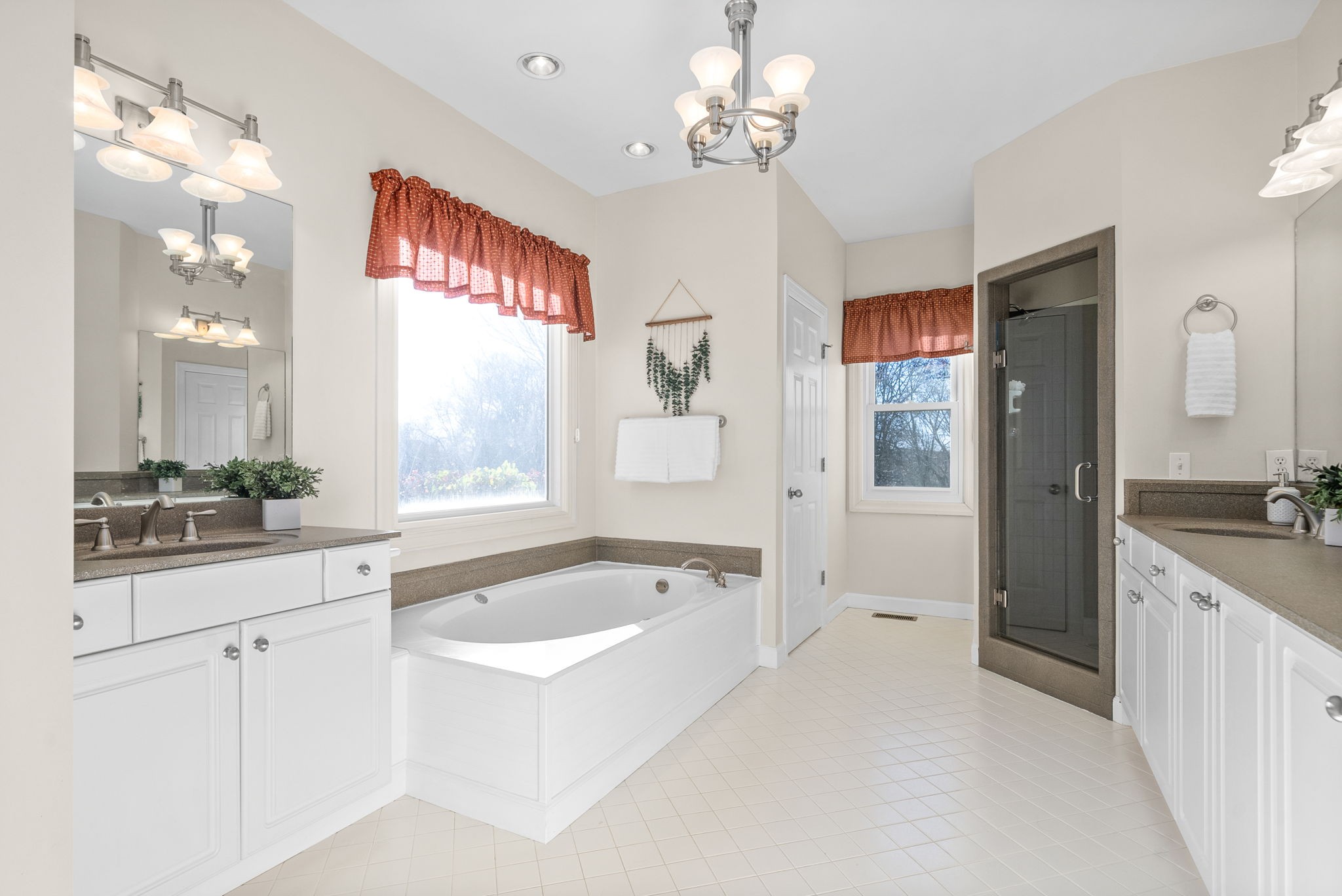 1904 Springcroft Drive Franklin, TN 37067 - Photo 16 of 30 a spacious bathroom with a granite countertop tub sink and mirror