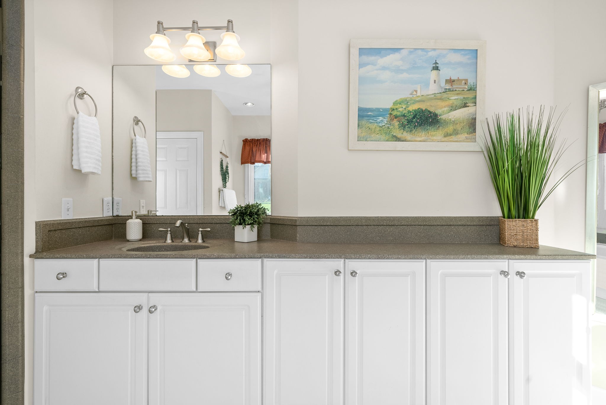 1904 Springcroft Drive Franklin, TN 37067 - Photo 17 of 30 a bathroom with a sink a vanity and a mirror