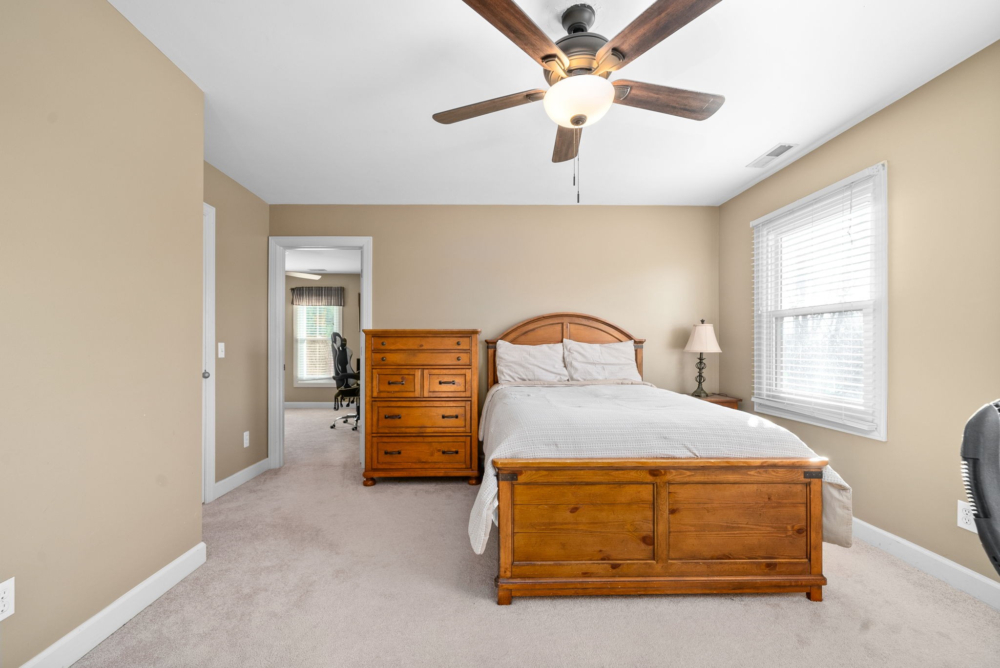 1904 Springcroft Drive Franklin, TN 37067 - Photo 23 of 30 a bedroom with a bed and a chandelier