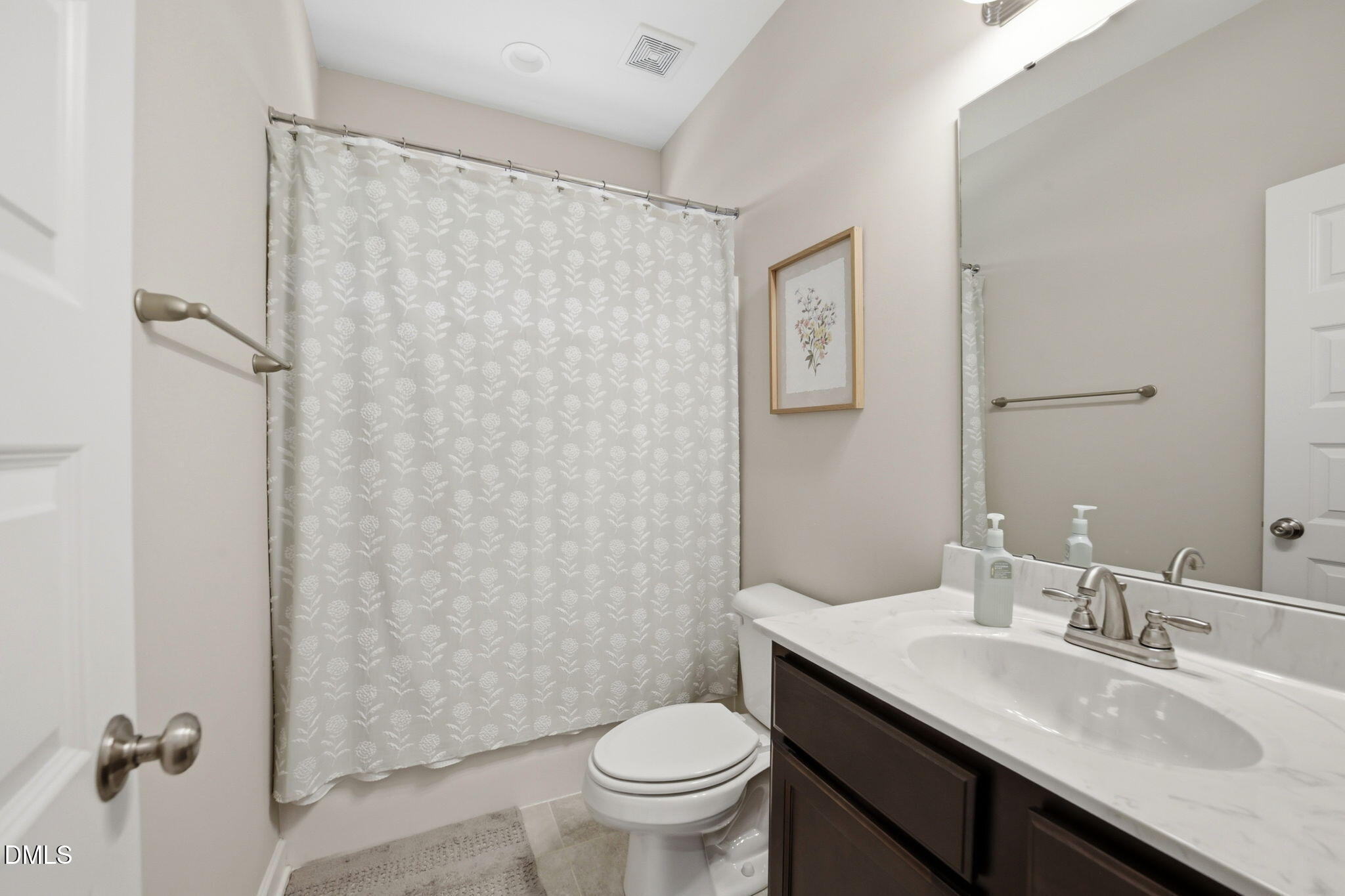 1547 Lassiter Pond Road Four Oaks, NC 27524 - Photo 25 of 45 a bathroom with a granite countertop sink toilet and a mirror