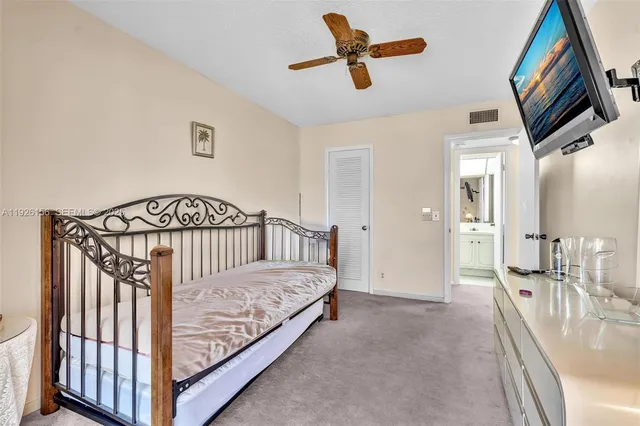 a view of a hallway with a bedroom