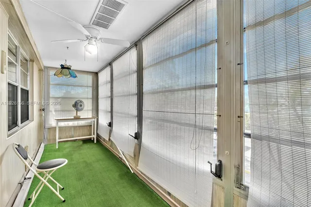 a bathroom with a glass door shower and a yard