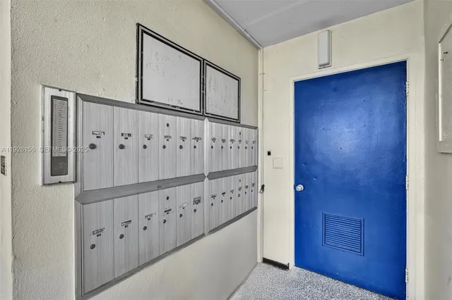 a view of a hallway with wooden door