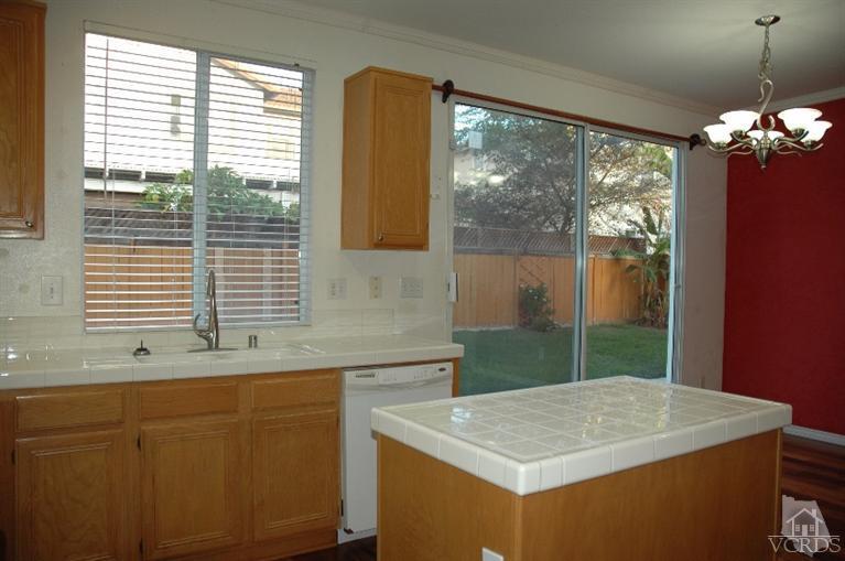 802 Pivot Point Way Oxnard, CA 93035 - Photo 5 of 13 a kitchen with a sink and large window