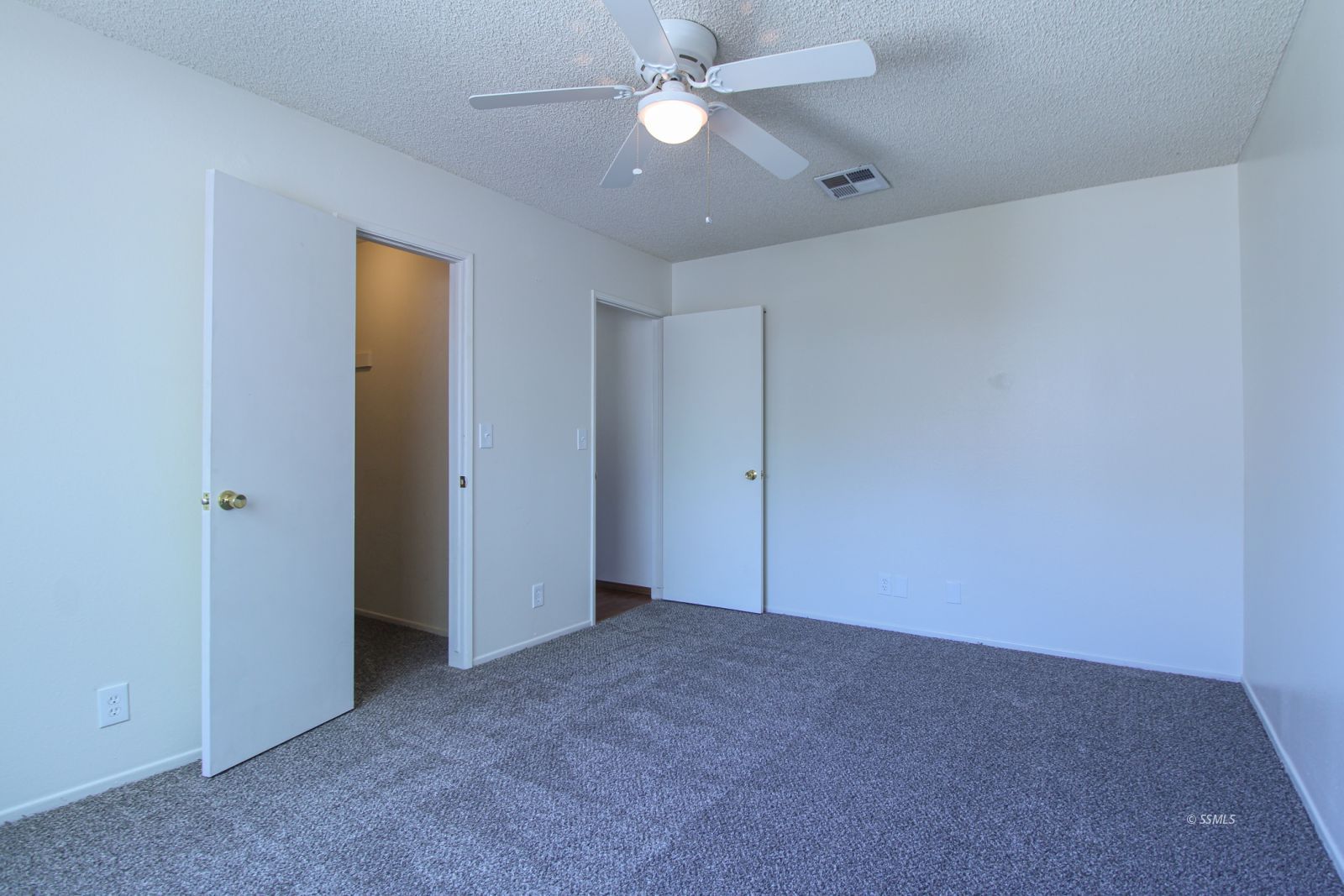 609 South Appaloosa Street Ridgecrest, CA 93555 - Photo 25 of 44 a view of an empty room with a ceiling fan