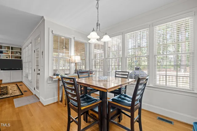 a view of a dining room with furniture window and outside view