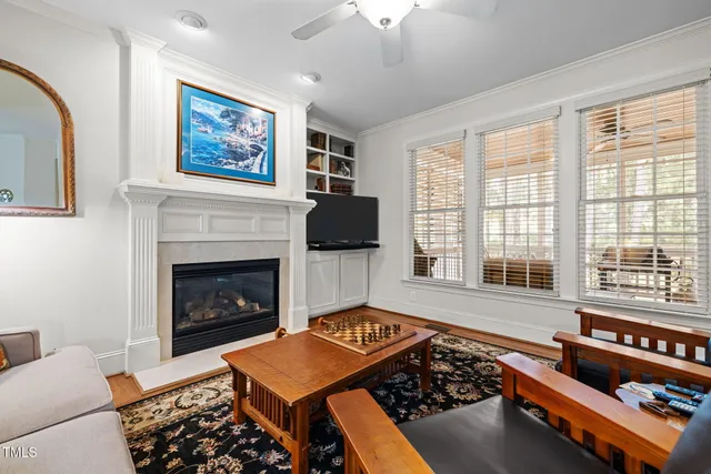 a bedroom with furniture and a fireplace