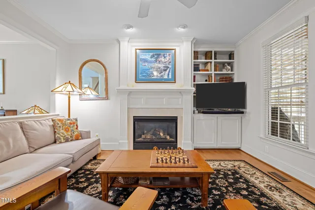 a living room with furniture a rug and a fireplace
