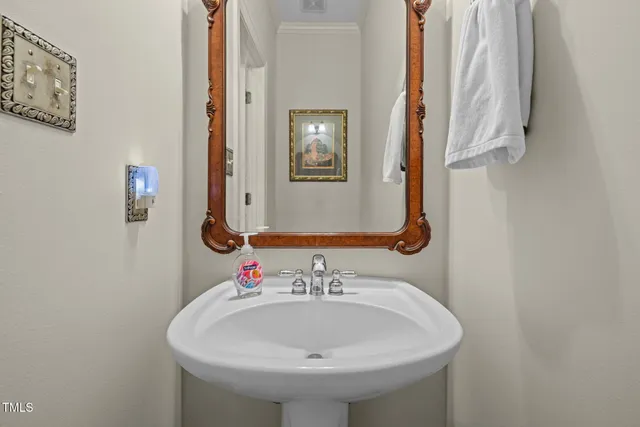 a bathroom with a granite countertop sink a toilet and a mirror