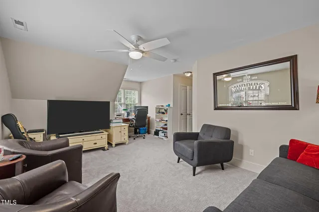 a view of a backyard with sitting area and garden