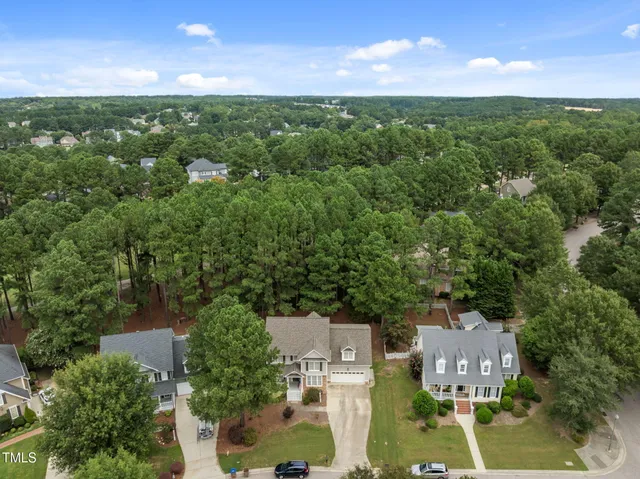 an aerial view of a house with a swimming pool