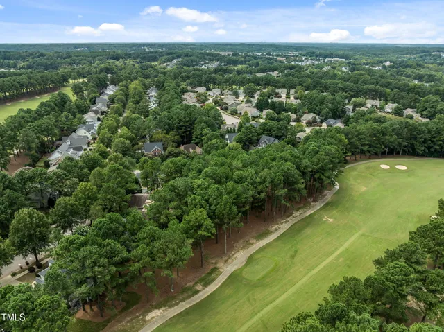 an aerial view of a residential houses with outdoor space