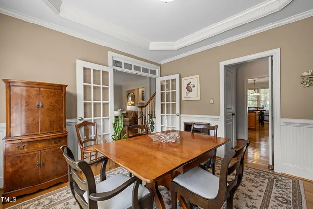 a view of a dining room with furniture and a window