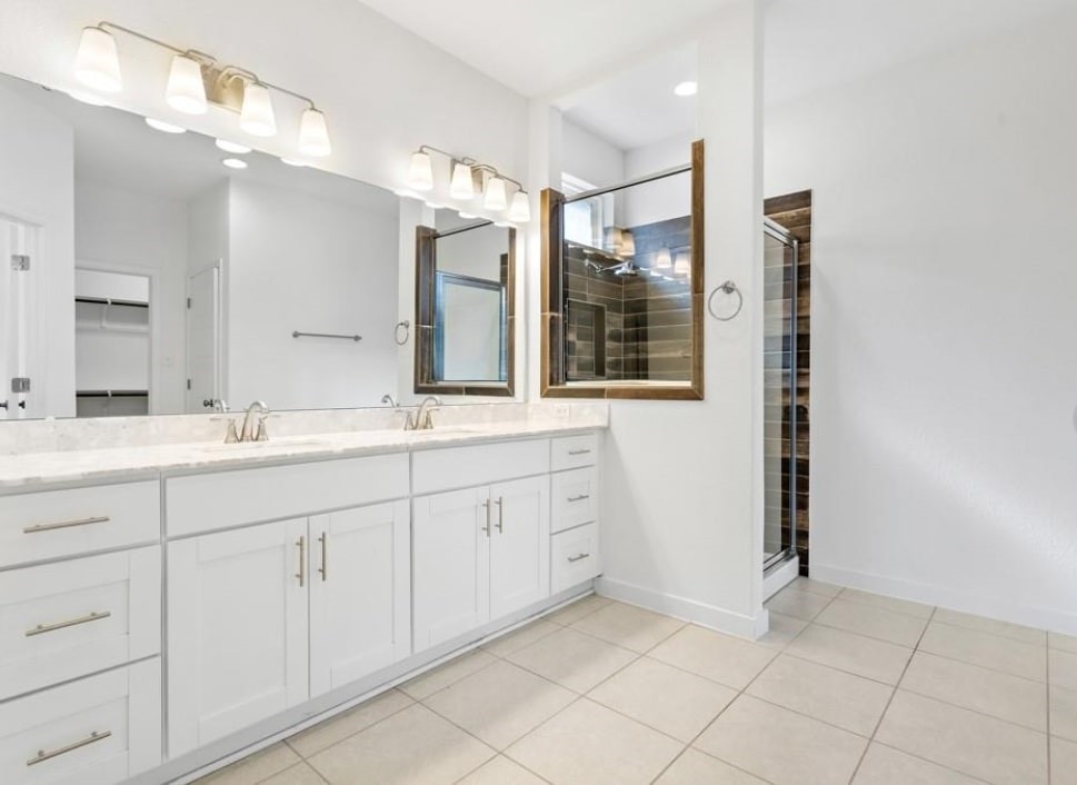 121 San Domenico Cove Georgetown, TX 78628 - Photo 19 of 24 a bathroom with a granite countertop sink mirror and