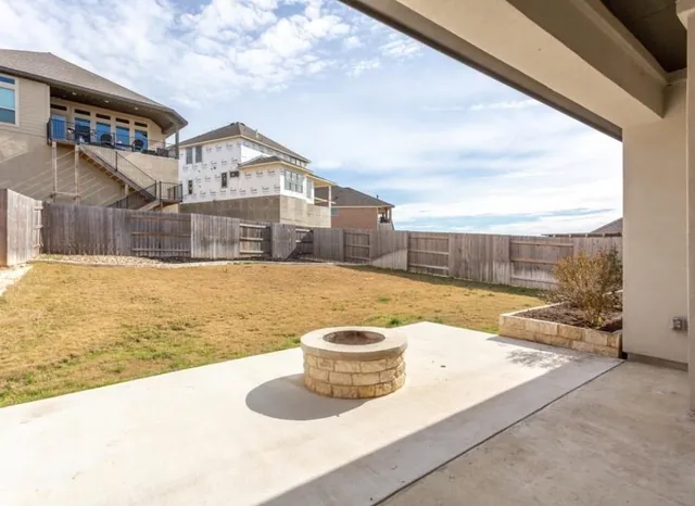 a view of a house with swimming pool and sitting area