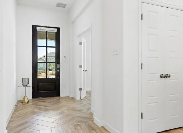 a view of an empty room with a window