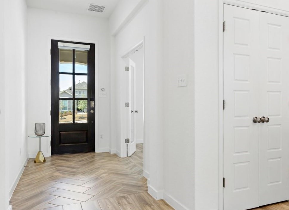 121 San Domenico Cove Georgetown, TX 78628 - Photo 3 of 24 a view of an empty room with a window