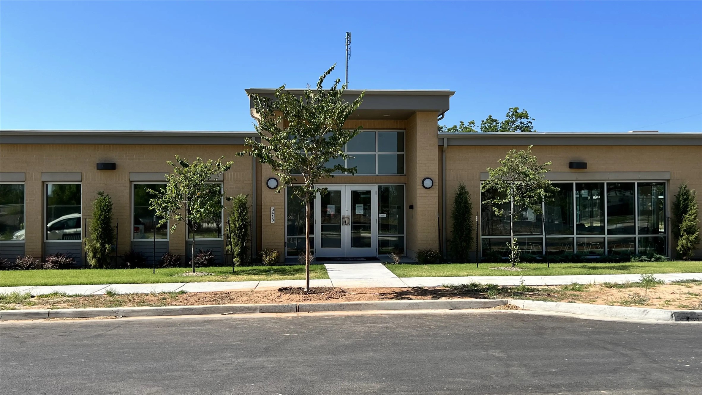 a view of a brick house with a large windows