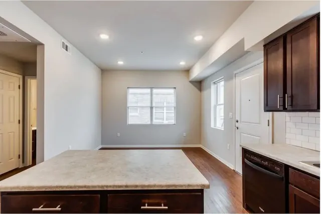 a view of kitchen and wooden floor