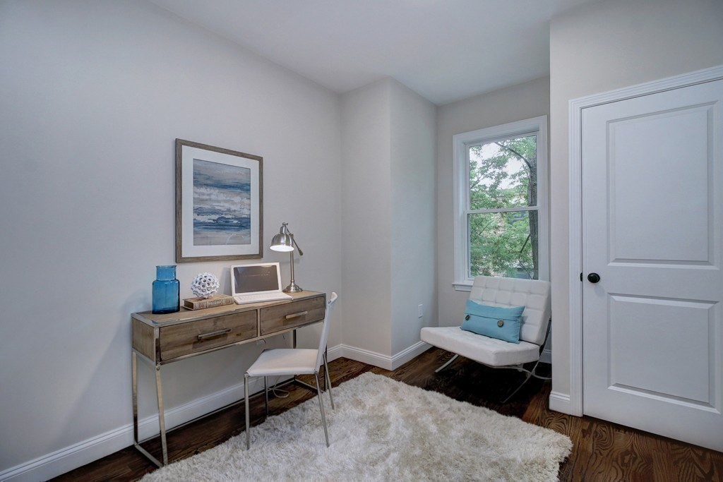 757 Washington Street, Unit 1 Boston, MA 02124 - Photo 14 of 17 a room with furniture and a window