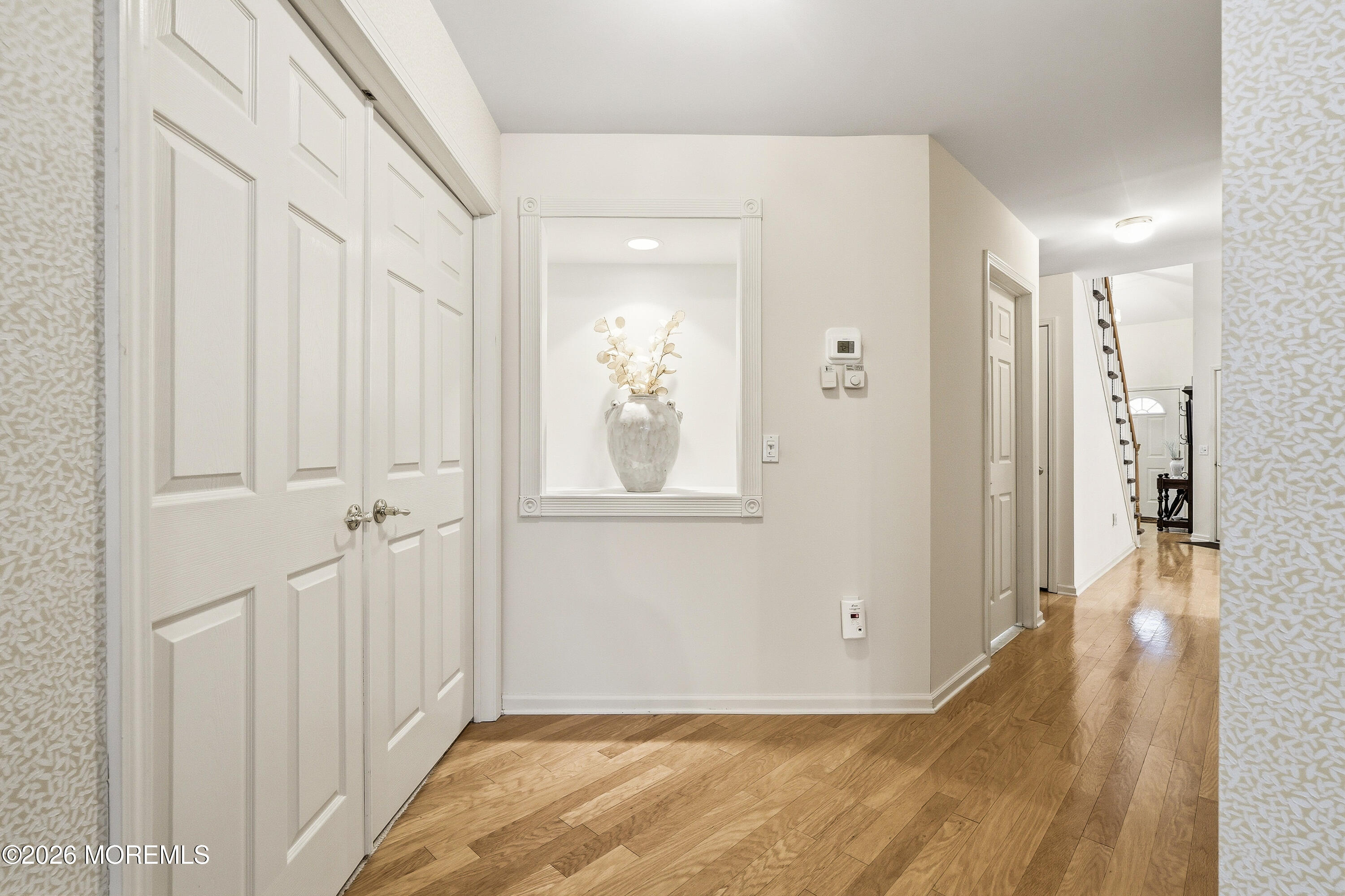 8 Casco Court Lakewood, NJ 08701 - Photo 24 of 56 a view of a hallway with wooden floor and closet area