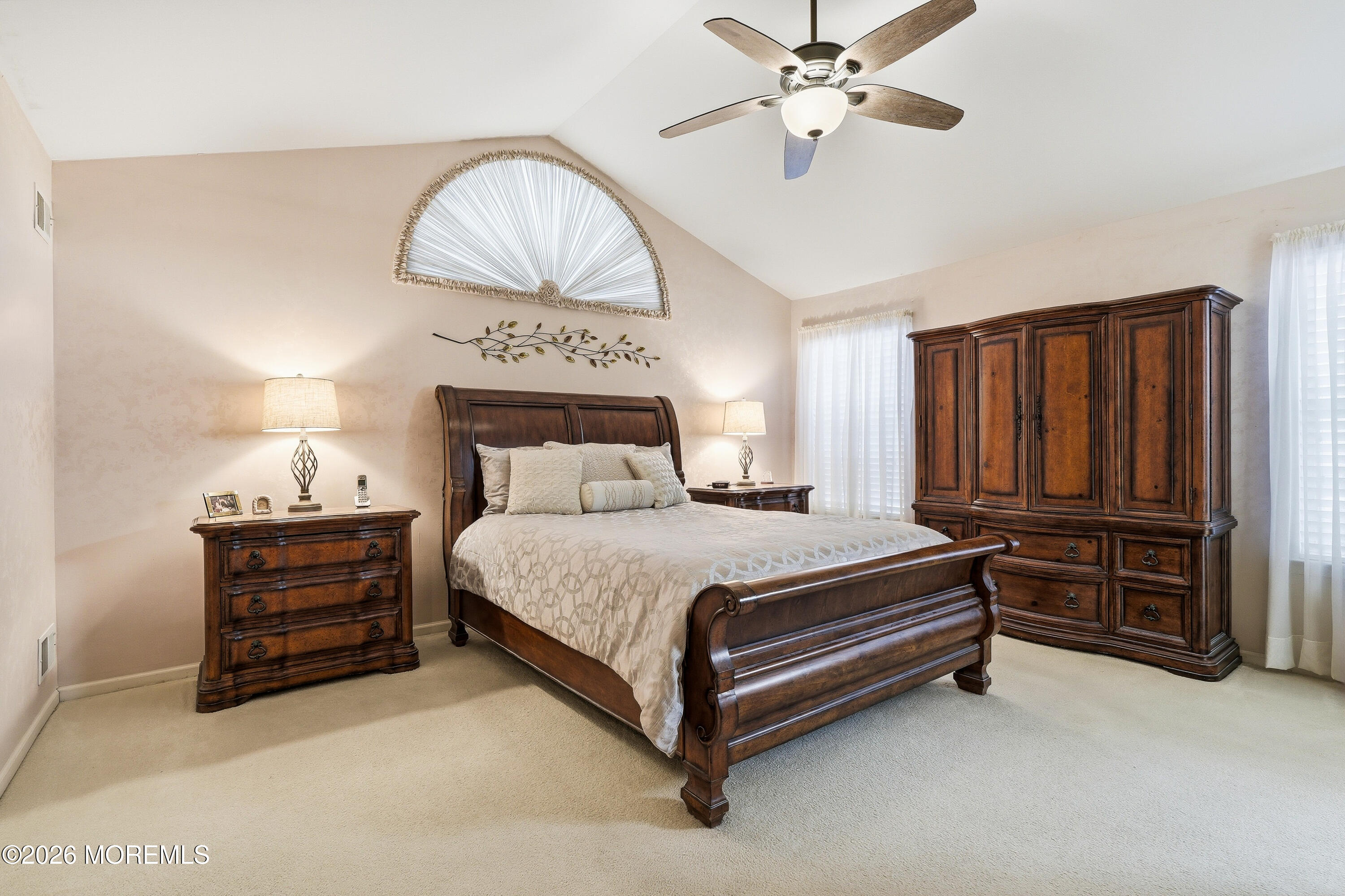 8 Casco Court Lakewood, NJ 08701 - Photo 26 of 56 a bedroom with a bed and a chandelier