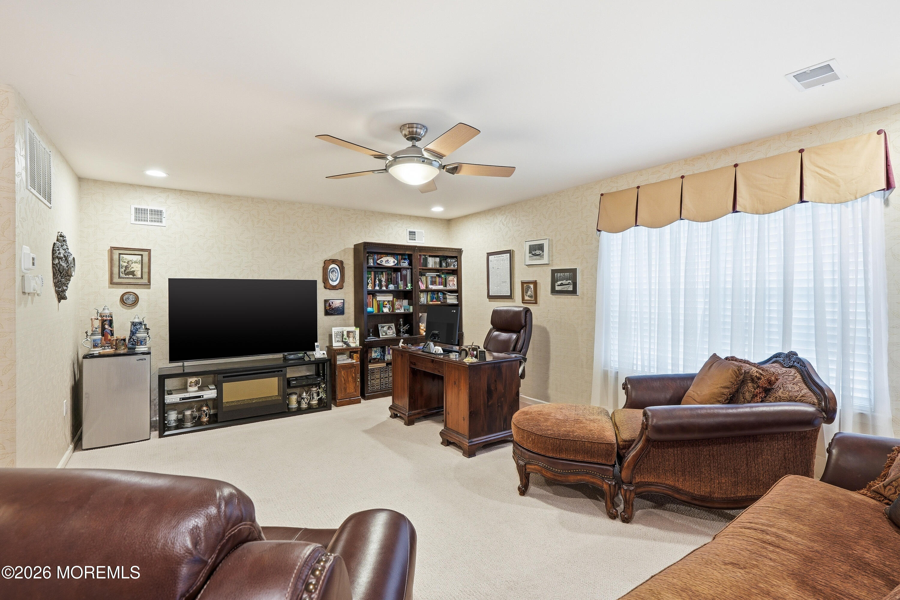 8 Casco Court Lakewood, NJ 08701 - Photo 33 of 56 a living room with furniture and a flat screen tv
