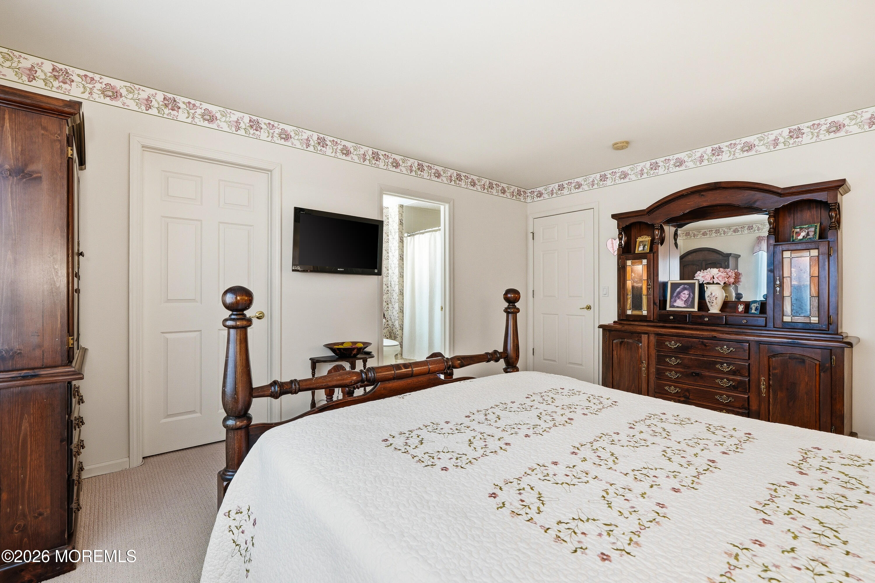 8 Casco Court Lakewood, NJ 08701 - Photo 37 of 56 a bedroom with a bed and a large mirror with a flat tv screen