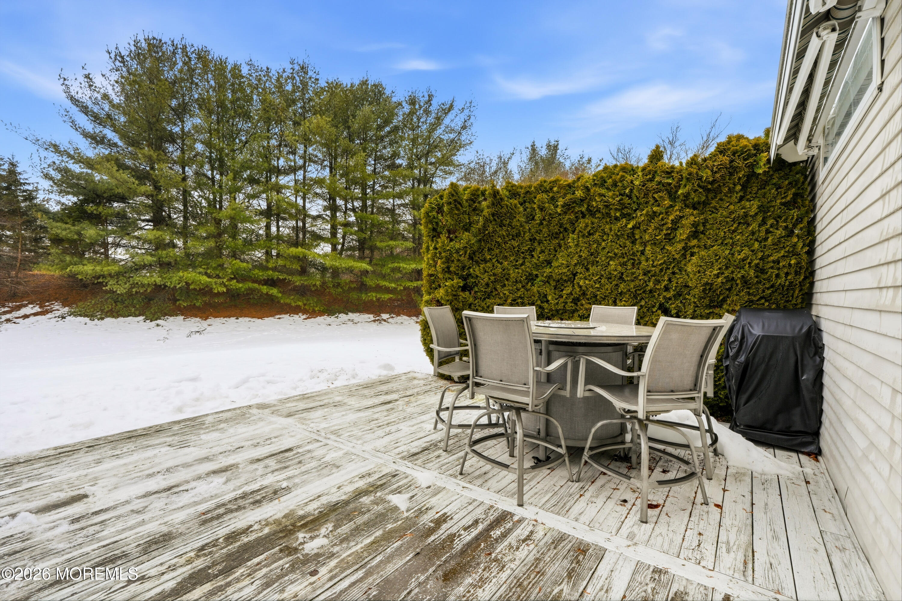 8 Casco Court Lakewood, NJ 08701 - Photo 42 of 56 a view of a patio with table and chairs with wooden floor and fence