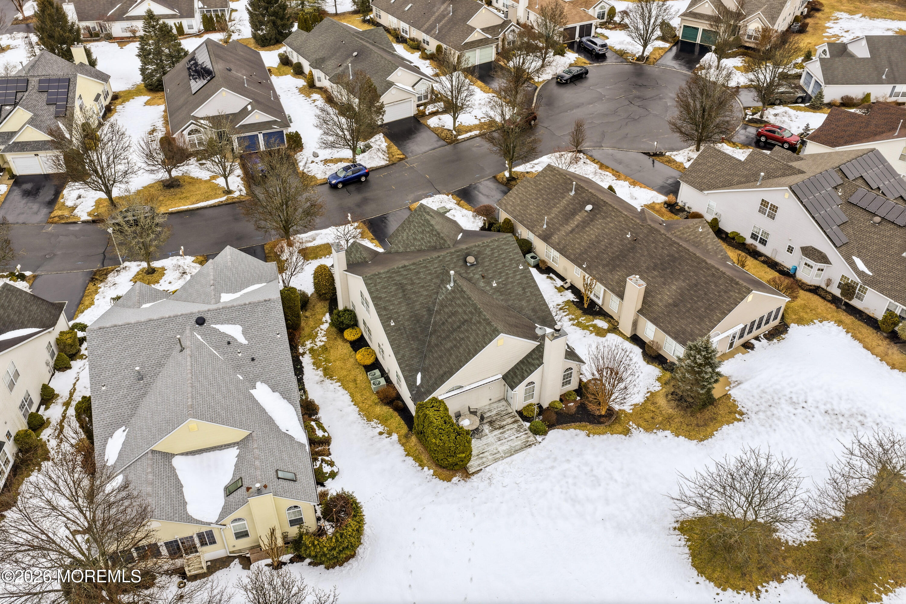 8 Casco Court Lakewood, NJ 08701 - Photo 44 of 56 an aerial view of a house with a yard and parking spaces