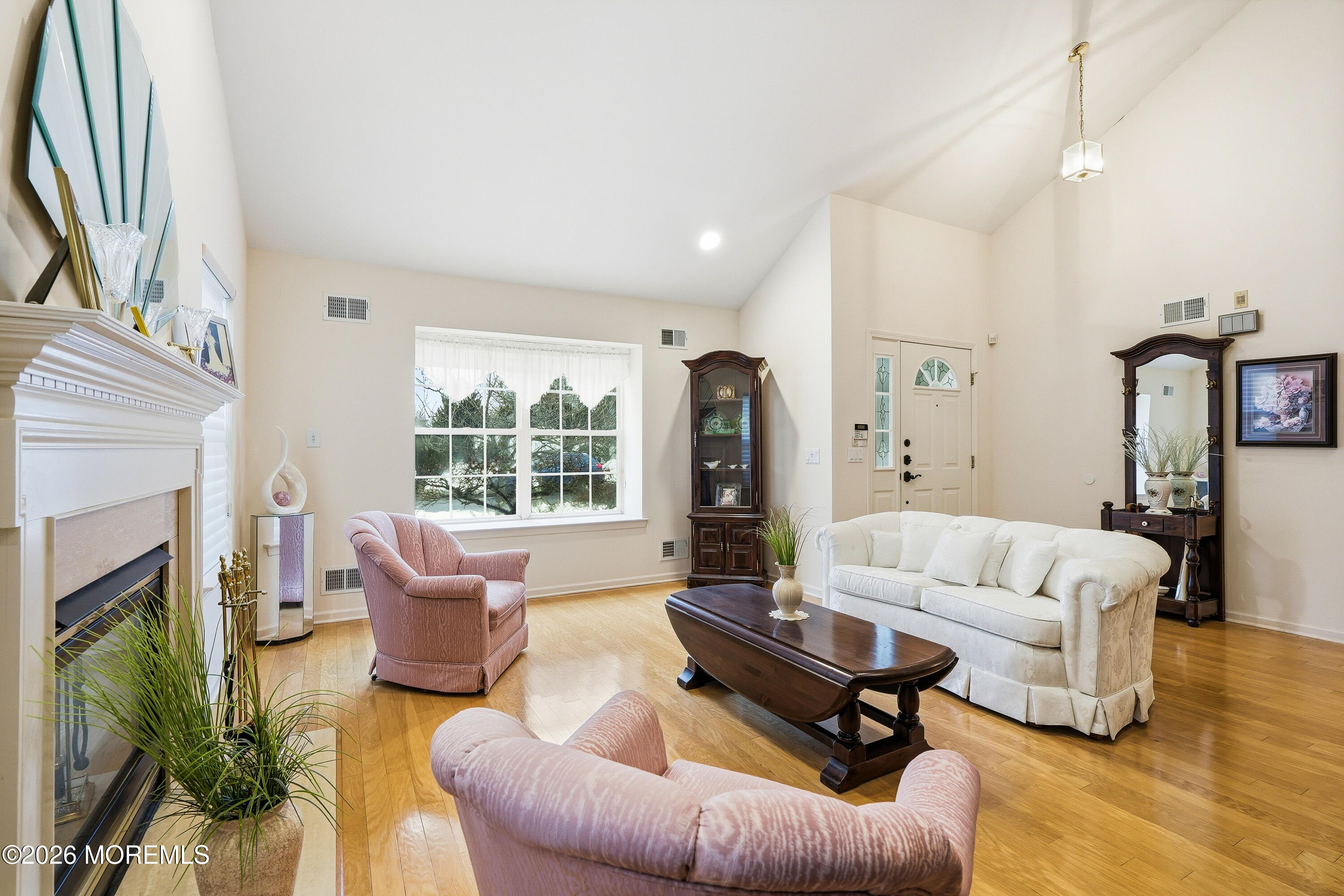 8 Casco Court Lakewood, NJ 08701 - Photo 10 of 56 a living room with furniture fireplace and a large window