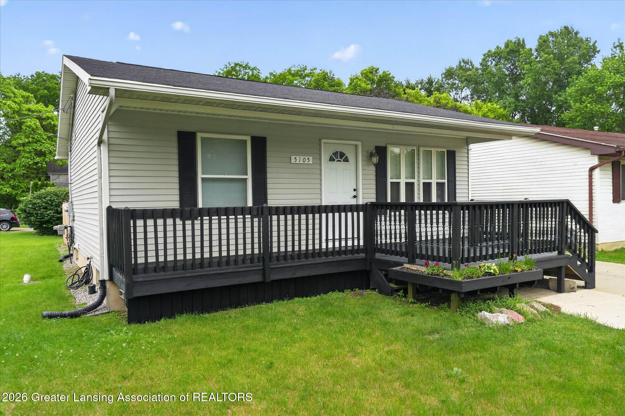 5105 Hughes Road Lansing, MI 48911 - Photo 2 of 26 02-5105-Hughes-Rd-WindowStill-Photograph