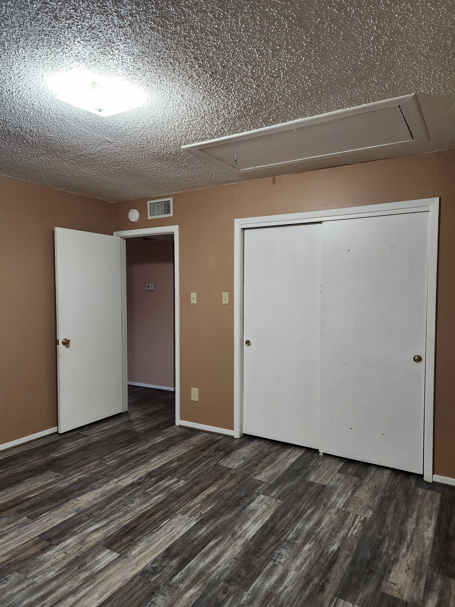 1252 Eagle Lake Road, Unit 8 Sealy, TX 77474 - Photo 15 of 18 The secondary bedroom also offers ceiling fan. In addition to pull down stairs for additional attic storage.