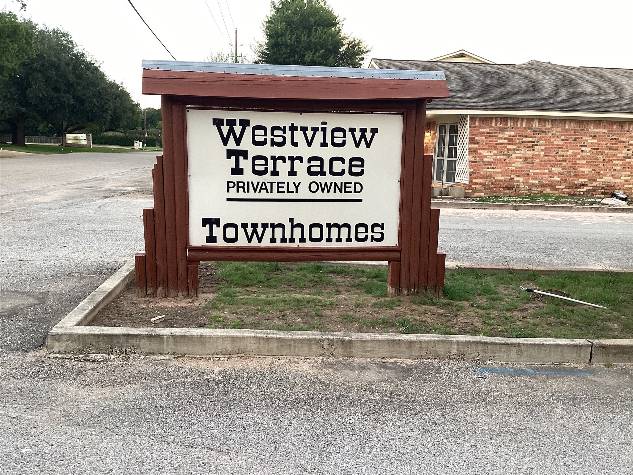 1252 Eagle Lake Road, Unit 8 Sealy, TX 77474 - Photo 17 of 18 a sign on the side of a road