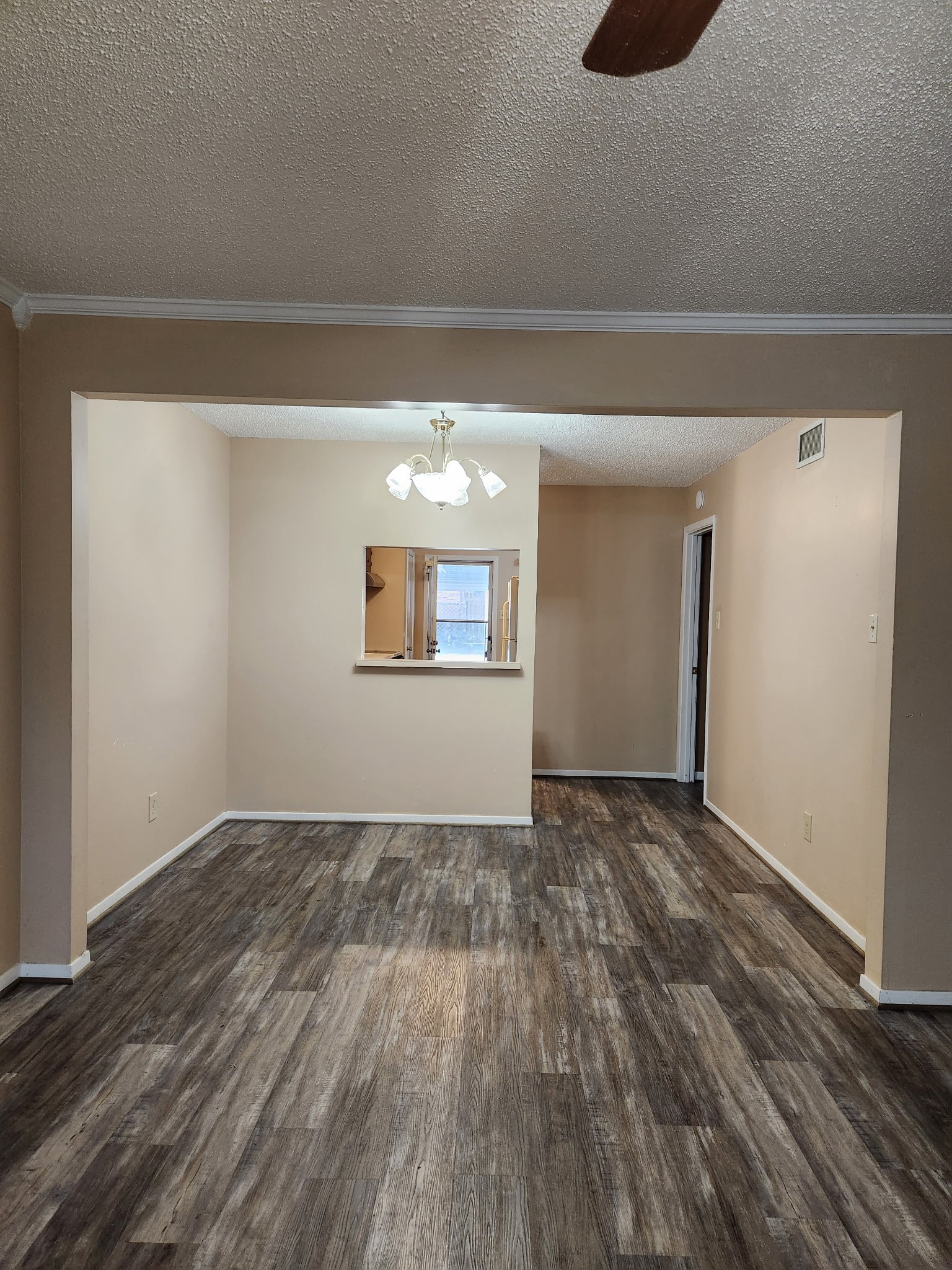 1252 Eagle Lake Road, Unit 8 Sealy, TX 77474 - Photo 4 of 18 It features an open layout with a pass-through to the kitchen, making it ideal for flexible dining and living arrangements.