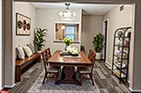 a dining room with furniture potted plants and wooden floor
