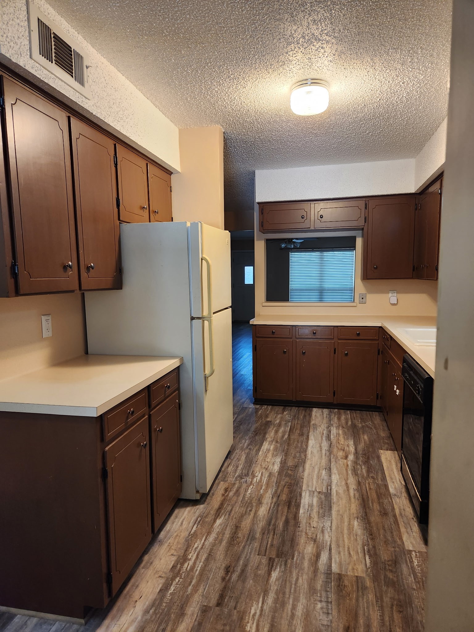 1252 Eagle Lake Road, Unit 8 Sealy, TX 77474 - Photo 6 of 18 It features an open layout with a pass-through to the kitchen, making it ideal for flexible dining and living arrangements.