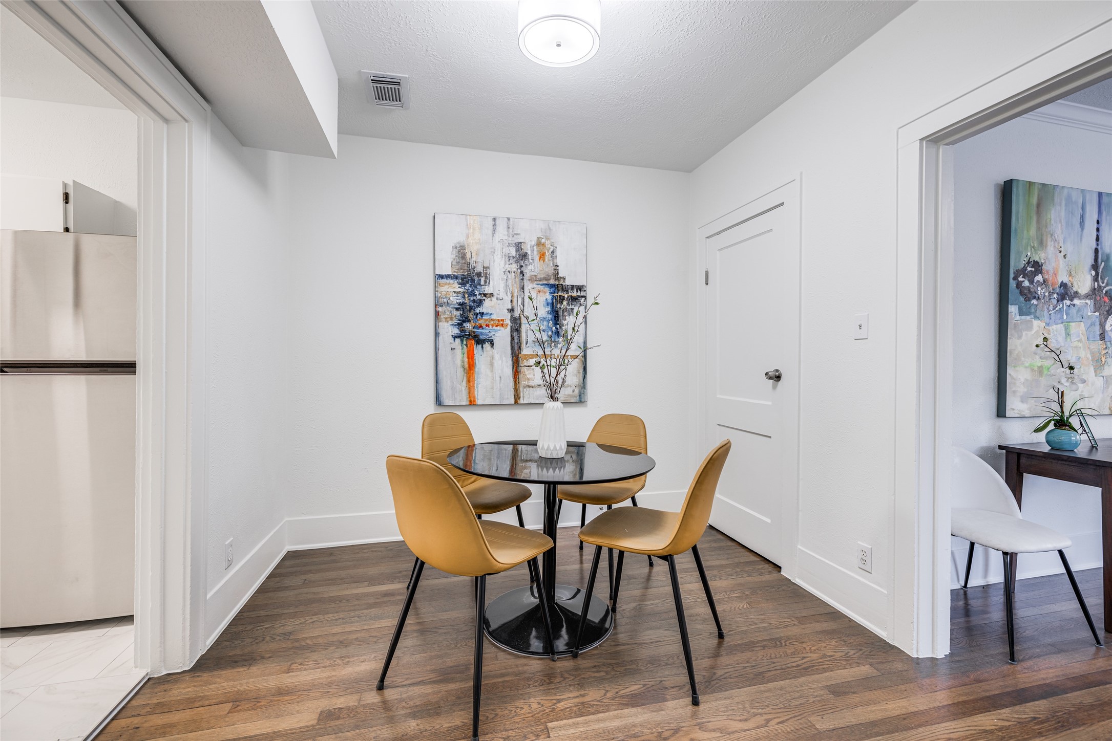 605 Bomar Street, Unit 3 Houston, TX 77006 - Photo 17 of 27 a view of a dining room with furniture and wooden floor