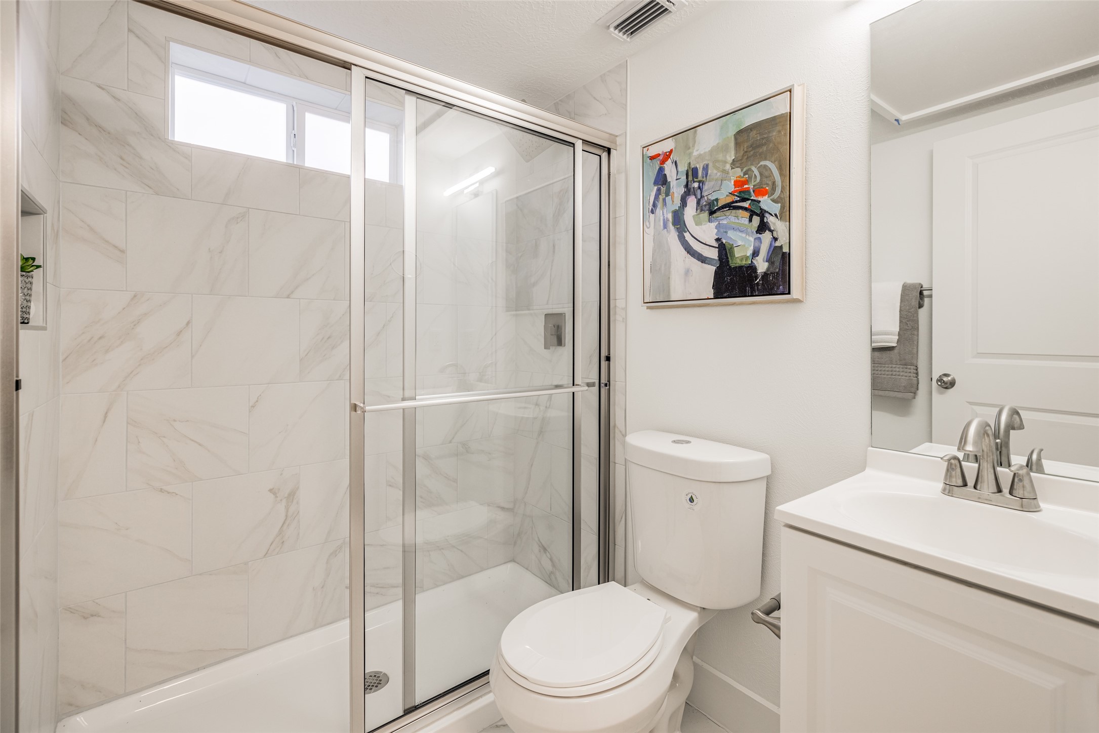 605 Bomar Street, Unit 3 Houston, TX 77006 - Photo 26 of 27 a bathroom with a toilet a sink and a shower