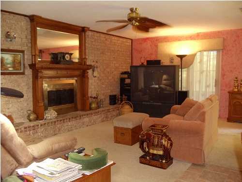199 Country Club Road Shalimar, FL 32579 - Photo 12 of 21 a living room with furniture and a fireplace