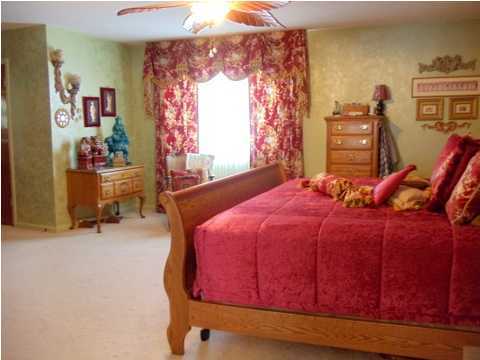 199 Country Club Road Shalimar, FL 32579 - Photo 15 of 21 a bedroom with a bed and wooden floor