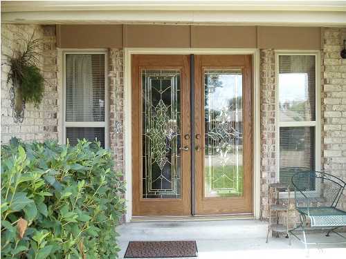 199 Country Club Road Shalimar, FL 32579 - Photo 5 of 21 a view of a glass door with a glass door and a window