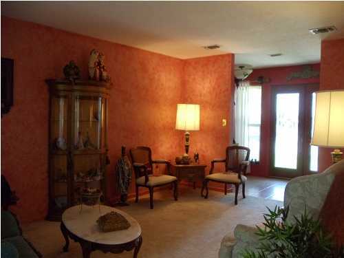 199 Country Club Road Shalimar, FL 32579 - Photo 8 of 21 a living room with furniture and a fireplace