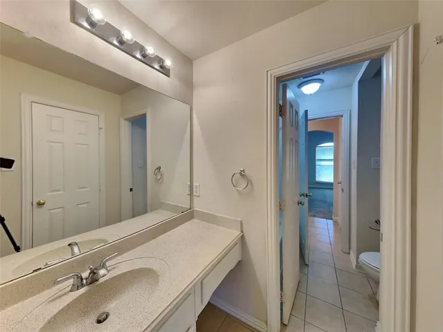 a bathroom with a sink and mirror