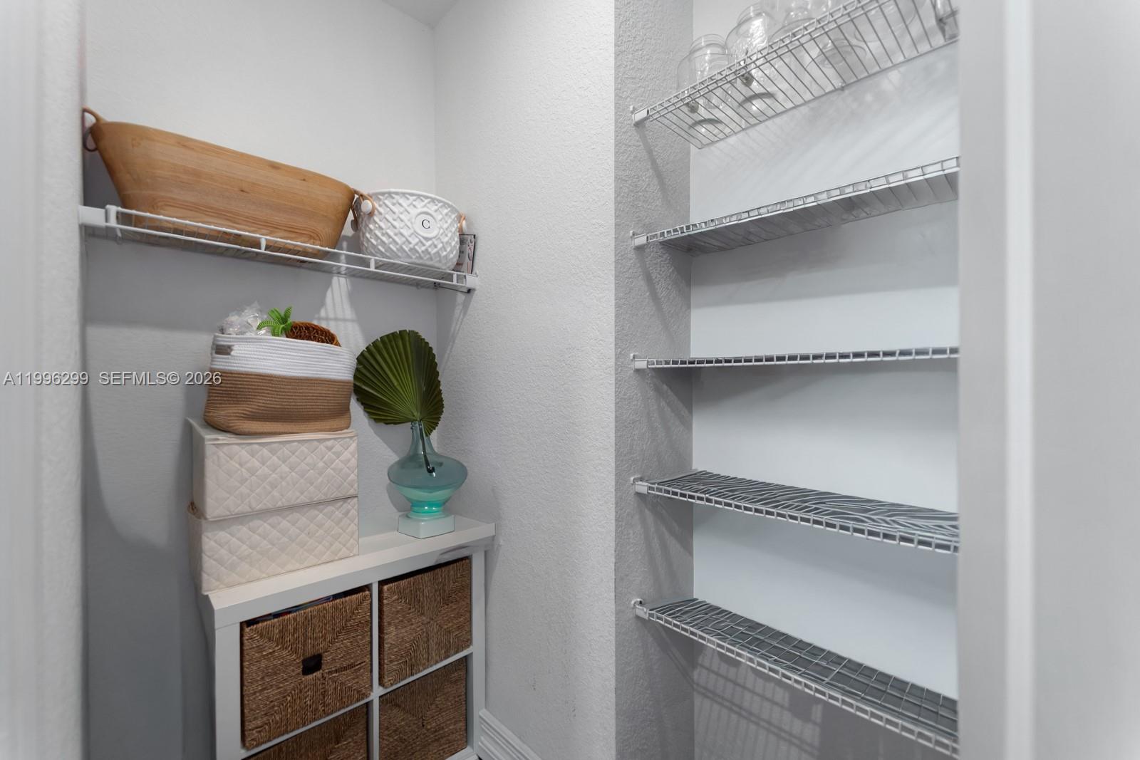 19781 Southwest 84th Court Cutler Bay, FL 33189 - Photo 21 of 53 a close view of shoes stand and cabinets