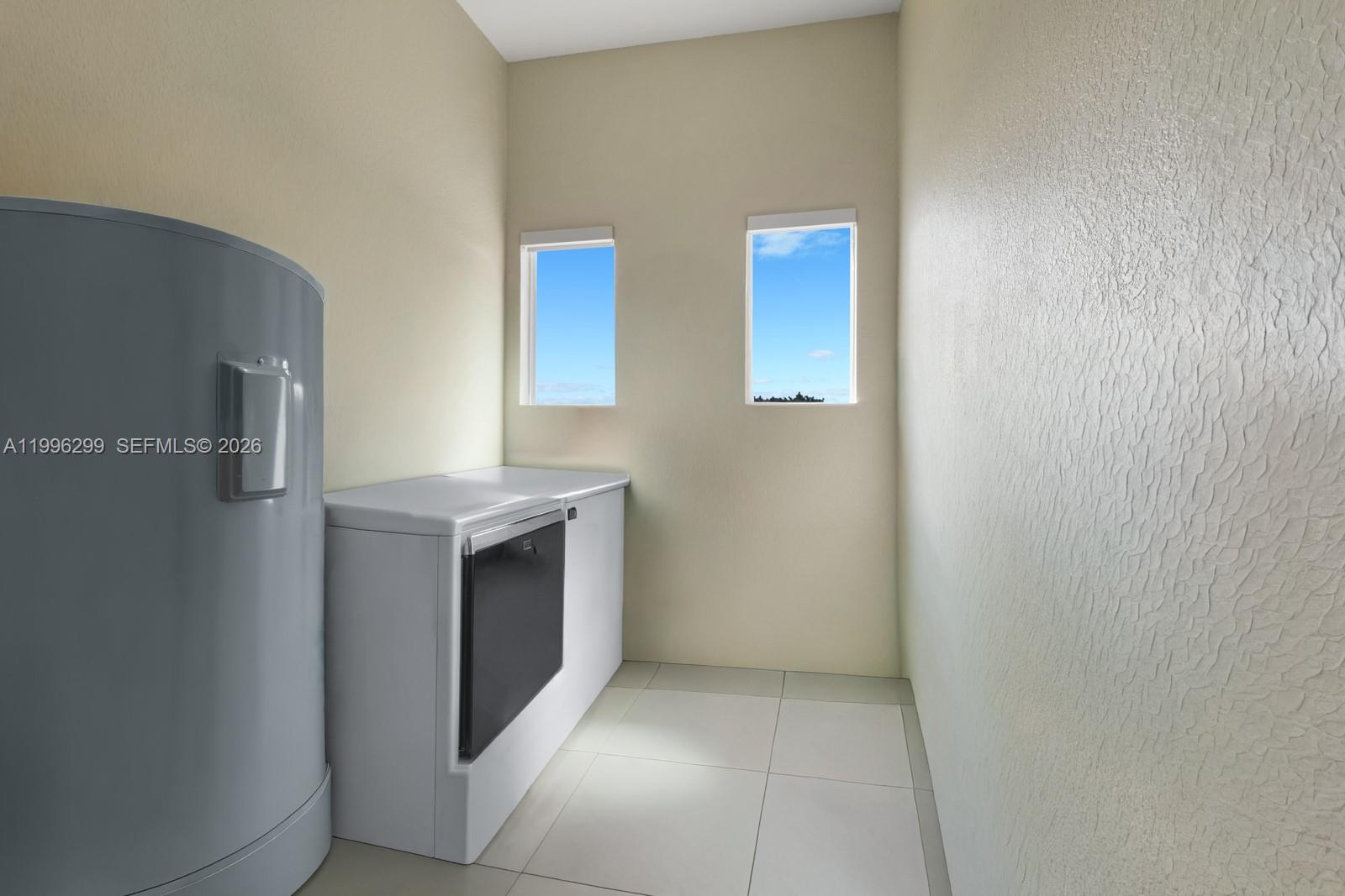 19781 Southwest 84th Court Cutler Bay, FL 33189 - Photo 37 of 53 a view of an empty room with two washing machine and sink