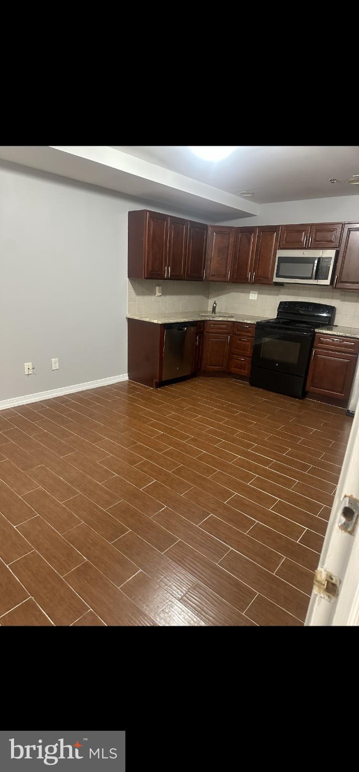 391 Martin Street Philadelphia, PA 19128 - Photo 7 of 10 a view of kitchen with stainless steel appliances
